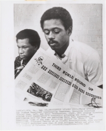 Stanley Wise and Ralph Featherstone of the SNCC displaying a newsletter at a press conference
