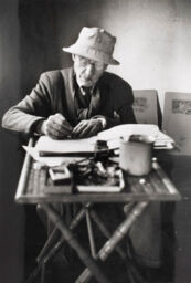 [Pierre Bonnard working in his home, La Cannet, France]