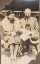 Ford Madox Ford with hat sitting with woman