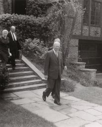 President Eisenhower decending the steps of Cornell President Mallot's House