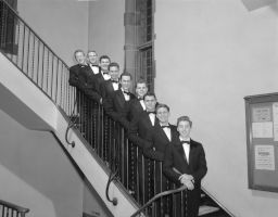 Cayuga's Waiters standing on stairs (possibly in Willard Straight Hall).