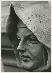 Carved head (grotesque or gargoyle) on exterior of Johnston Hall