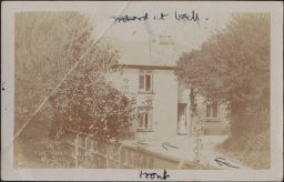 Unidentified woman in front of Knap Cottage; notes in Hunt's hand label front and orchard in back.