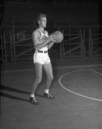 James Tucker Gale, '48, holding basketball