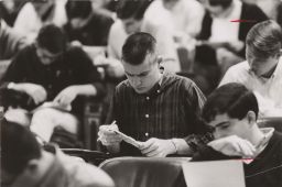 Student with slide rule, early 1960's?
