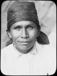Portrait of young man in white, with a large bandana