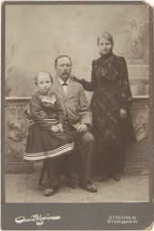 Unidentified photo of a man with two girls.