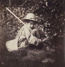 [Seated young man with staff and satchel]