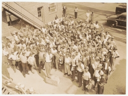 Jerome H. Holland with group of workers