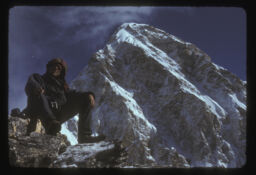baseko manis ra pachiltira himal (बसेको मानिस र पछिल्लतिर हिमाल / Seated Man With Mountain in the Background)