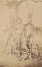 Three indigenous Peruvian people; two male, one female.