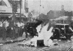 V-J Day on campus. Students and others created a bonfire at 37th St. and Woodland Ave. after declaration of the end of the war in the Pacific, news clipping