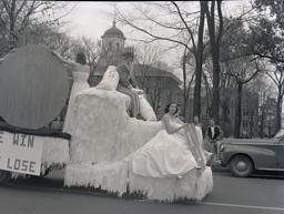 Homecoming float passing by Main Hall