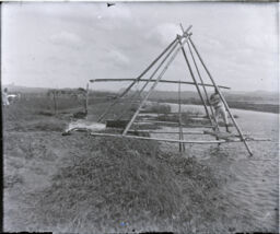 Irrigating rice with a trangular-shaped bamboo irrigation system