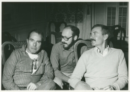 Three men sitting on Vermont trip