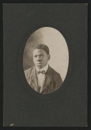 Young man in a suit and bow tie