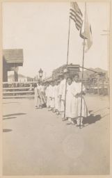 [Procession of children carrying Korean and American flags]