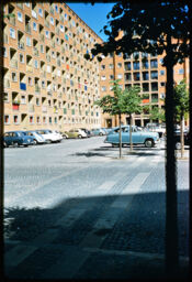 Parking area abutting a large apartment tower (Christians Garden, Copenhagen, DK)