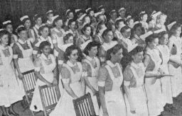 School of Nursing (University Hospital) student chorus takes part in a chapel service commemorating the end of war in the Pacific, news clipping