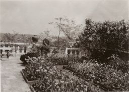 Garden/patio, with balustrade, urn, and table at rear