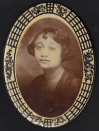 Portrait in an oval button frame of a young woman
