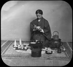 Japanese man surrounded by cookware