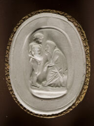 Boy Holding a Sphere Before a Woman