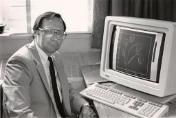 John Abel Sitting in Front of a Computer
