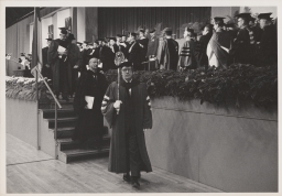 Cornell president James A. Perkins (on stairs) in Barton Hall at Centennial celebration