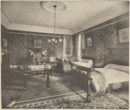 Bedroom with double beds and dark walls in Horne residence
