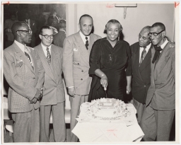 Ethel Waters cutting cake with Bojangles Robinson and others 