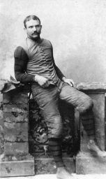 George W. Woodruff (1864-1934), LL.B. 1895, in  football attire, portrait photograph