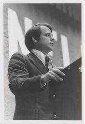 Close-up of Theodore Lowi standing at a podium during the New York Convocation