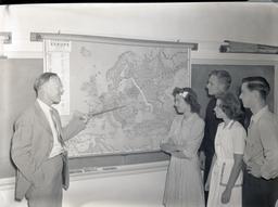 Professor showing students language map of Europe