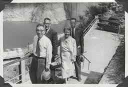 William I. Myers and others in front of a dam.
