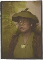 Woman in green hat and dress