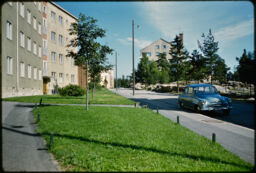 Nearby residential buildings and a street from the sidewalk (Hiitomaki, Helsinki, FI)