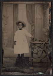 Child in dress and hat