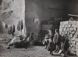 [Family living in a cave for protection during World War II, Naples, Italy]