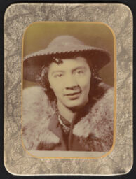 Portrait of a woman wearing a hat in a rectangular button frame
