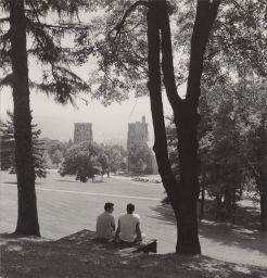 Students on the slope overlooking Baker Dorms, McFaddin and Lyon Towers.