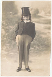 Young male impersonator in top hat and suit