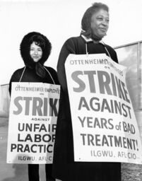 An Asian American and an African American woman wear signs that indicate that they are on strike against Ottenheimer for poor treatment and unfair labor practices