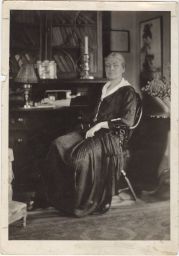 Portrait of Ellen Biddle Shipman seated at her desk