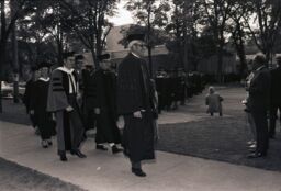 Faculty processional across College Avenue for Commencement