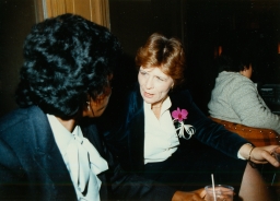 Virginia (Ginny) Apuzzo, Executive Director (1983-1985) of the then National Gay Task Force, speaking with another woman.
