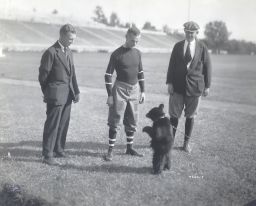 "Touchdown III", Cornell University football team's black bear cub mascot, standing on Franklin Field