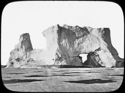 Iceberg with large hole through it, N. Greenland
