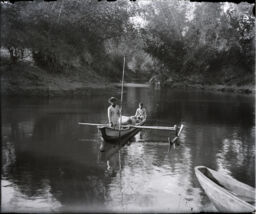Two men on a boat in Laguna de Bay 