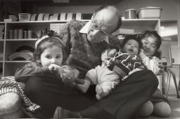 Dr. Urie Bronfenbrenner visits with children in the Cornell Early Childhood Program.